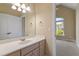 Bathroom featuring a vanity with sink, a large mirror, and neutral colored paint at 134 Barclay Valley Dr, Cary, NC 27519