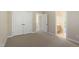 Bedroom featuring carpet, neutral paint, a closet, and multiple doors leading to other rooms at 134 Barclay Valley Dr, Cary, NC 27519