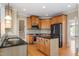 Well-equipped kitchen with granite countertops, island, stainless steel appliances and maple cabinetry at 134 Barclay Valley Dr, Cary, NC 27519