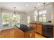 Bright kitchen with granite countertops, stainless steel appliances, and an eat-in area with large windows at 134 Barclay Valley Dr, Cary, NC 27519
