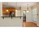 Open kitchen layout with breakfast bar, stainless appliances and hardwood floors create an ideal space at 134 Barclay Valley Dr, Cary, NC 27519
