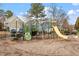 Community playground with a variety of play equipment, offering a fun and safe environment for  at 134 Barclay Valley Dr, Cary, NC 27519