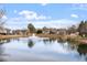 Scenic community pond with a central fountain, surrounded by lush landscaping and beautiful homes at 134 Barclay Valley Dr, Cary, NC 27519