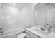 Bright bathroom featuring a shower-tub combo with modern sink vanity at 1533 Crescent Townes Way, Raleigh, NC 27604