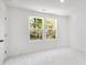 Bright bedroom with natural light and neutral carpet at 1533 Crescent Townes Way, Raleigh, NC 27604
