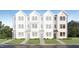 New townhouse construction with a white exterior, lawn, and sidewalk leading to the entrance at 1533 Crescent Townes Way, Raleigh, NC 27604