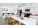 Spacious kitchen featuring stainless steel appliances and a large island with seating at 1533 Crescent Townes Way, Raleigh, NC 27604