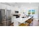Modern kitchen features stainless steel appliances and an eat-in island at 1533 Crescent Townes Way, Raleigh, NC 27604