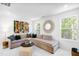 Bright living room featuring a comfortable sectional sofa and decorative pillows at 1533 Crescent Townes Way, Raleigh, NC 27604