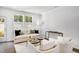 Bright living room with neutral tones, modern furniture, and plenty of natural light at 1533 Crescent Townes Way, Raleigh, NC 27604