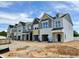 New construction townhomes boast multi-tone exterior paint, individual garages, and modern architectural design at 154 Ripple Way # 320, Clayton, NC 27520