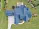 Aerial view of roof of this luxury home with patio and play area at 1633 Estate Valley Ln, Raleigh, NC 27613
