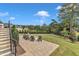 Backyard firepit seating area offers an inviting space to relax outdoors at 1633 Estate Valley Ln, Raleigh, NC 27613