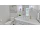 Clean bathroom featuring a white vanity, toilet, and decorative wall art at 1633 Estate Valley Ln, Raleigh, NC 27613