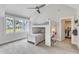 Bright bedroom with a bunk bed, carpet, and a closet filled with clothing at 1633 Estate Valley Ln, Raleigh, NC 27613