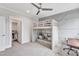 Charming bedroom featuring a bunk bed with a cozy lower lounge area and walk-in closet at 1633 Estate Valley Ln, Raleigh, NC 27613