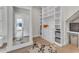Organized walk-in closet with custom shelving, drawers, and ample storage space at 1633 Estate Valley Ln, Raleigh, NC 27613