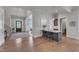 Open entryway with bar, hardwood floors, and staircase to the second level at 1633 Estate Valley Ln, Raleigh, NC 27613