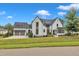 Stunning two-story home boasting a modern design, landscaped yard, and an inviting entrance at 1633 Estate Valley Ln, Raleigh, NC 27613