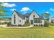 Beautiful two-story home with well-manicured lawn and landscaping at 1633 Estate Valley Ln, Raleigh, NC 27613