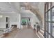 Stunning foyer featuring hardwood floors, an elegant staircase, and an open layout leading to the living spaces at 1633 Estate Valley Ln, Raleigh, NC 27613