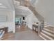 Beautiful foyer featuring a staircase, hardwood floors, and an open view into the adjoining living space at 1633 Estate Valley Ln, Raleigh, NC 27613