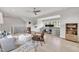 Large living room features hard wood floors, gray sofa, leather chairs, white ceilings and walls at 1633 Estate Valley Ln, Raleigh, NC 27613