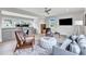 Spacious living room with a cozy seating area, hardwood floors, and a work space at 1633 Estate Valley Ln, Raleigh, NC 27613