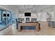 Bright living room featuring a fireplace, coffered ceilings, and large sliding glass doors to the outdoor patio at 1633 Estate Valley Ln, Raleigh, NC 27613