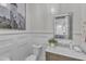 Chic powder room with marble countertop, modern fixtures, and decorative mirror at 1633 Estate Valley Ln, Raleigh, NC 27613