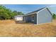 Home exterior featuring a well-kept yard and blue siding at 19 Southern Village Dr, Roxboro, NC 27573
