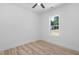 Bedroom with hardwood floors and natural light from a single window at 19 Southern Village Dr, Roxboro, NC 27573