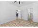 Neutral bedroom with hardwood floors, ceiling fan, and access to bathroom and kitchen at 19 Southern Village Dr, Roxboro, NC 27573
