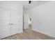 Bright bedroom features closet with double doors and a glimpse into the next room at 19 Southern Village Dr, Roxboro, NC 27573