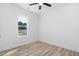 Well-lit bedroom with a ceiling fan and a view to the outdoors at 19 Southern Village Dr, Roxboro, NC 27573