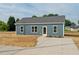 Charming single story home featuring a concrete driveway and minimalist landscaping at 19 Southern Village Dr, Roxboro, NC 27573
