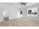 Bright living room featuring hardwood floors, a ceiling fan and plenty of natural light at 19 Southern Village Dr, Roxboro, NC 27573