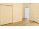 Bedroom featuring a double door closet and a light-colored hardwood floor at 203 Standish Dr, Chapel Hill, NC 27517