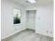 Bright bedroom with a window, neutral color palette and closet at 203 Standish Dr, Chapel Hill, NC 27517