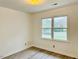 Bedroom featuring a large window at 203 Standish Dr, Chapel Hill, NC 27517