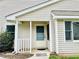 Inviting entryway with a covered porch and a decorative welcome mat at 203 Standish Dr, Chapel Hill, NC 27517