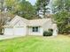 Charming single-story home featuring a two-car garage, tidy lawn, and inviting curb appeal at 203 Standish Dr, Chapel Hill, NC 27517