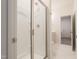 Bright bathroom featuring a glass shower, tile floors, and modern fixtures, adding elegance and functionality at 2089 Florine Dr, Apex, NC 27502