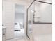 Bathroom with a view into the bedroom, and a glass shower with tiled walls and a modern showerhead at 2089 Florine Dr, Apex, NC 27502