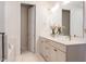 Stylish bathroom featuring double sinks, a vanity with elegant faucets, and a view of the shower and tub at 2089 Florine Dr, Apex, NC 27502
