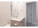 Clean and modern bathroom with a white vanity, bronze fixtures, and a framed mirror at 2089 Florine Dr, Apex, NC 27502