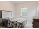 Cozy bedroom with large window, complemented by stylish furniture and comfortable furnishings at 2089 Florine Dr, Apex, NC 27502