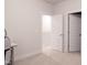 Bright bedroom featuring a desk, chair, and carpeted floor with an open doorway to another room at 2089 Florine Dr, Apex, NC 27502