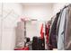 Walk-in closet with wire shelving, hanging clothes, and space for luggage and storage at 2089 Florine Dr, Apex, NC 27502