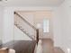 Dining room view featuring stairs, a front door view, and hardwood floors at 2089 Florine Dr, Apex, NC 27502